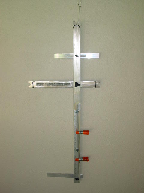 Foot locator for marking position on shooting line. tripod for tactile sight attaches to the front.